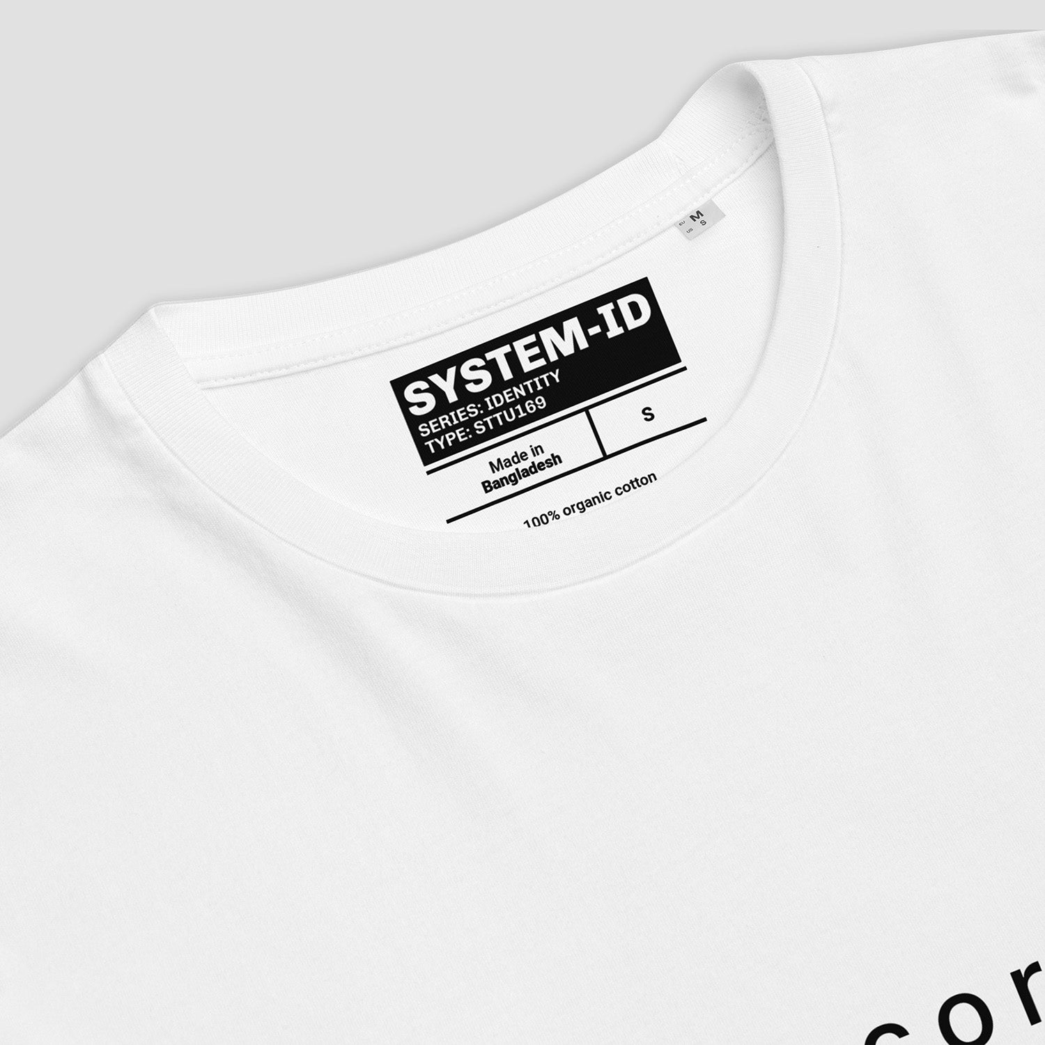 White t-shirt with a black label on a light gray background