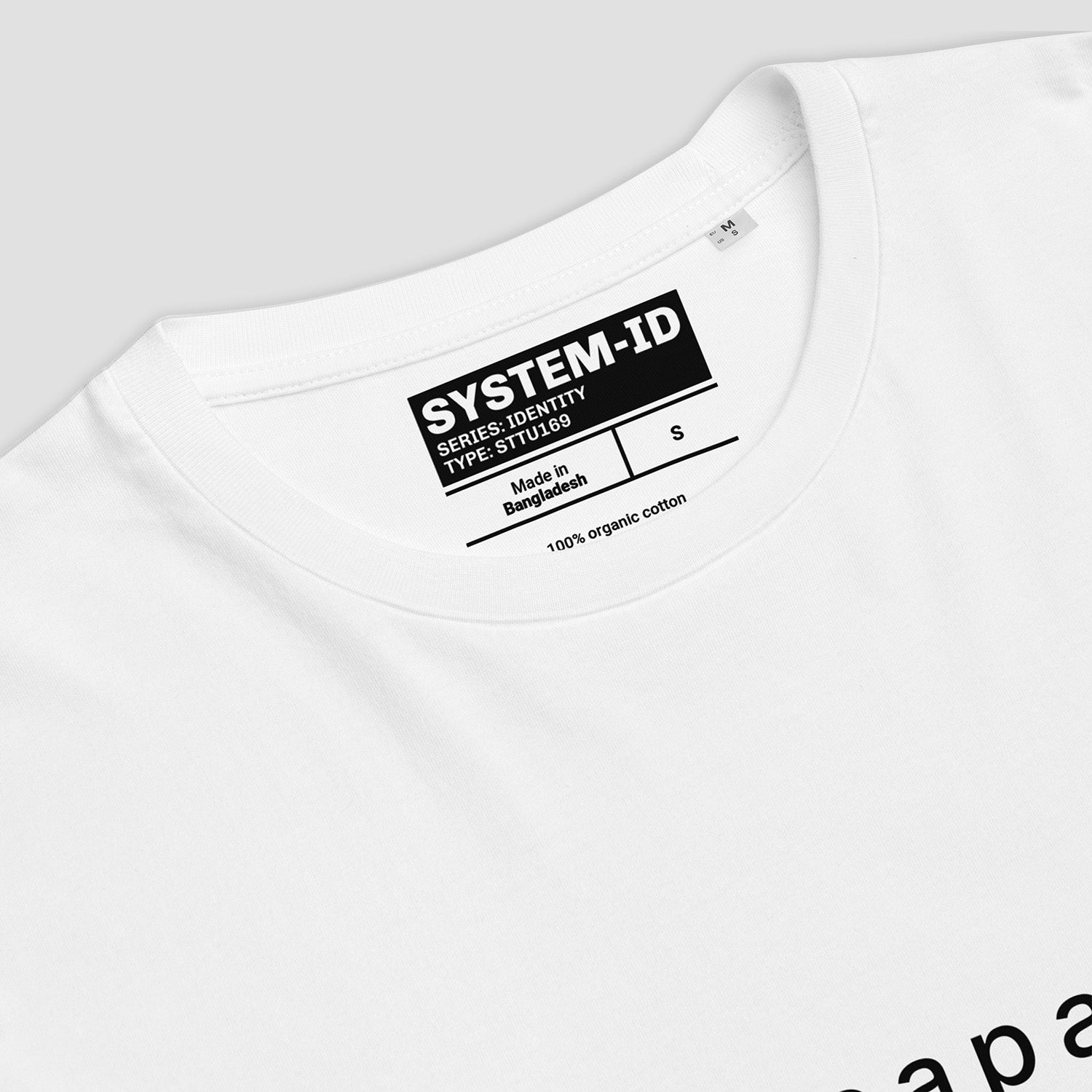 White t-shirt with a black label on a light gray background